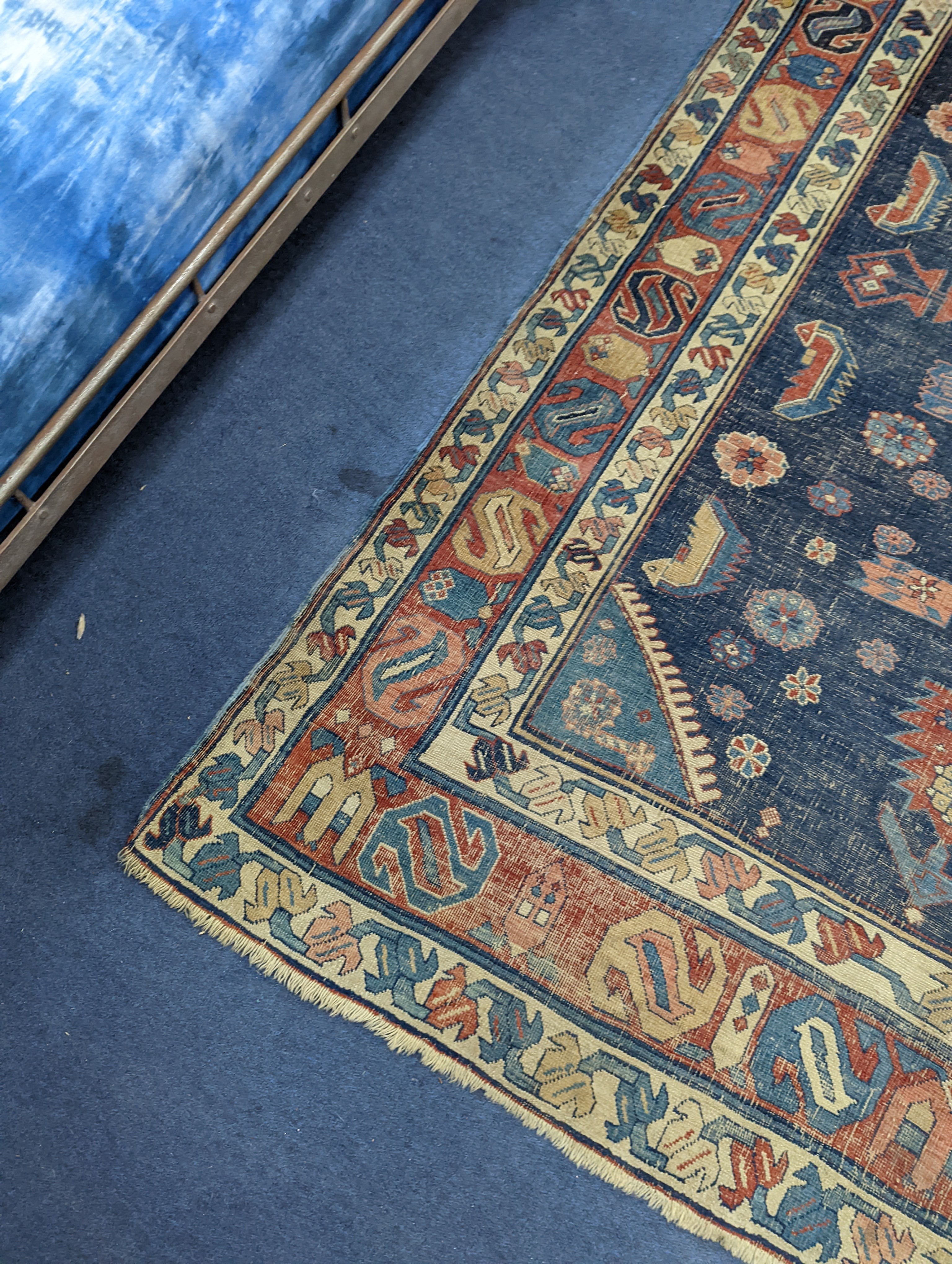 An antique Caucasian blue ground rug (worn), 200 x 148cm